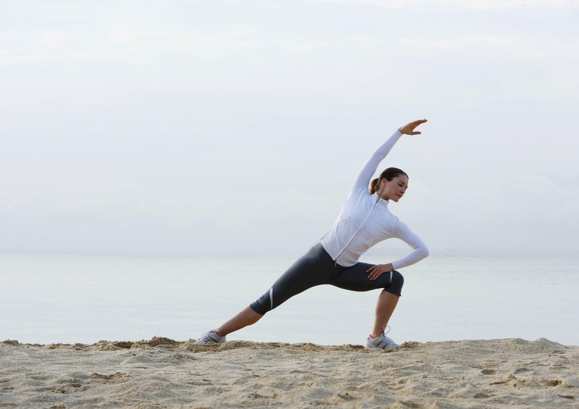 Séance de streching sur la plage